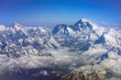 Himalaya mountains Everest and Lhotse, with snow flags and clouds, view from plane