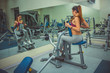 © sskenia - picture of young woman making exercise at the gym
