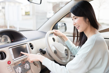 Wall Mural - young asian woman in the car