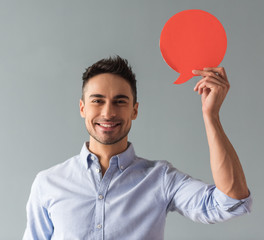 Wall Mural - Handsome guy with speech bubble