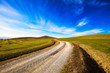 © stevanzz - Tuscany countryside, road, fieldd and meadow and rolling hills. Italy