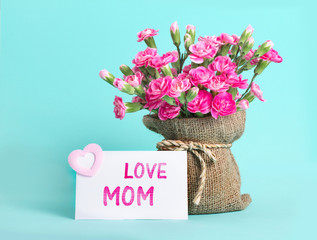 Wall Mural - beautiful blooming of  pink carnation flowers on with card and LOVE MOM message , mother's day concept