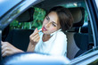 busy girl with lipstick and phone while driving