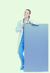 A female doctor with a blank billboard