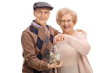 Poster - Elderly man holding money jar with elderly woman putting coin