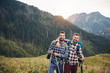 © mavoimages - Two friends trekking together in the mountains