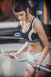 © de Art - beautiful young girl is engaged in sports and fitness, raises the bar closeup
