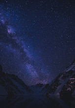 View Of Stars In Night Sky Above Mountains