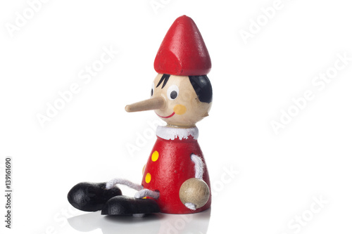 Wooden Pinocchio doll isolated on white background.