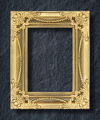 Wall Mural - gold frame on black slate background