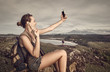 © soft_light - attractive woman tourist with a backpack makes self-portrait