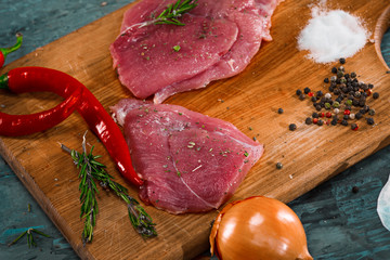 Poster - Pieces of raw pork steak with spices and herbs rosemary