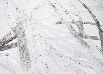  traces of cars on the road in winter