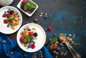 Wall Mural - Greek yogurt with granola and fresh berries.