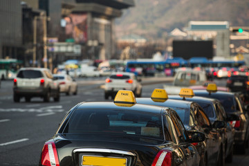 Taxi stand in a row on a city street.