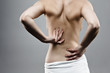 © Jacek Chabraszewski - Woman massaging pain back
