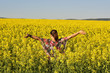 © brszattila - Young happy woman on blooming rapeseed field in spring