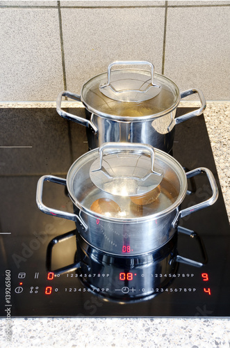 Cooking Pots On A Modern Black Glass Ceramic Cooktop Buy This