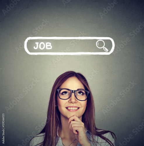 Fotografía Woman in glasses thinking looking for a new job