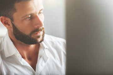 Wall Mural - Thoughtful man with monitor