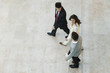 © PhotoAlto - Business people walking together in office lobby
