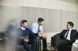 © PhotoAlto - Businessmen discussing in office