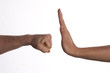 © Gecko Studio - One hand preventing punch attack of another hand on isolate white background.