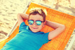 © sakkmesterke - Little boy relax on deckchair vintage