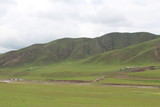 Fototapeta  - Amdo Tibet Tibetan Grassland Mountains Summer Grasslands Green Mountain Cloudy Sky China Qinghai