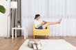 © zhu difeng - young pretty woman relaxes in room