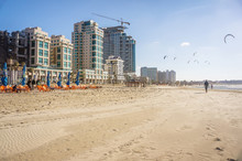 Urban Beach View Of Tel Aviv City With Many Kites In Sky And Wide Sea Shore, Mediterranean Sea, Israel