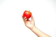 Hand Holding Red Apple, Isolated On A White Background.