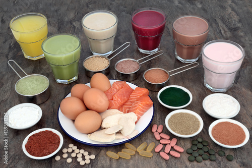 Fotografia Health Food and Drinks for Body Builders with high protein meat, fish, eggs and supplement powders with vitamin pills