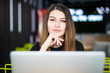 © F8  \ Suport Ukraine - Entrepreneur woman working with a laptop in a coffee shop or hub smart space