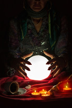 Hands From Gypsy Fortune Teller Above Magic Crystal Ball