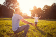 © luckybusiness - Father with daughter playing ball outdoor