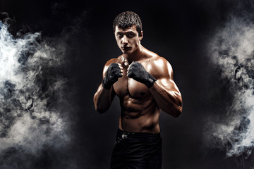 Wall Mural - Muscular topless fighter in boxing gloves