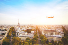 Travel To France, Airplane Flying Over Beautiful Panoramic Cityscape Of Paris With Eiffel Tower