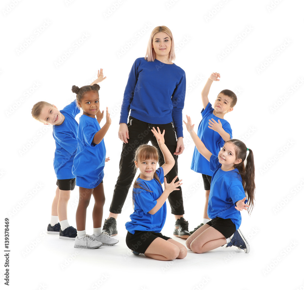 Dance teacher with children posing on white background