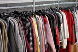 Row of men's suits hanging on hanger