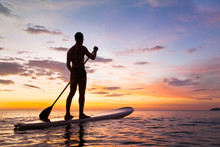 Paddleboard On The Beach At Sunset, Paddle Standing In Thailand