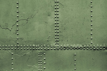 Old military green metal sheets with rivet