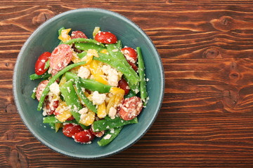 Wall Mural - Snow pea salad with feta, tomato and pepper