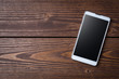 © Leszek Czerwonka - Modern smart phone on wooden table