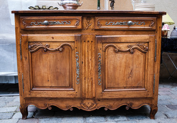 Vintage luxury dresser at flea market in Paris (France).