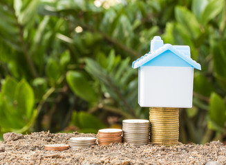 Saving to buy a house that stack  coin growing ,saving money or money growth concept