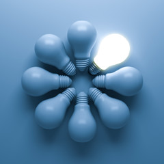 Poster - One glowing light bulb standing out from the unlit incandescent bulbs on blue background with shadow , individuality and different creative business idea concepts . 3D rendering.