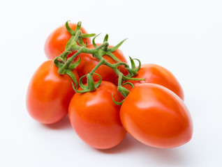 Wall Mural - Close up red cherry tomato on white background isolated.