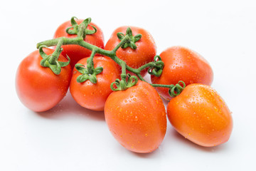 Wall Mural - Close up red cherry tomato on white background isolated.