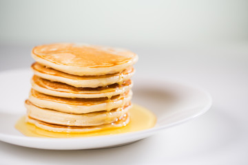 Wall Mural - Stack of Small pancakes in syrup